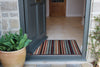 Atlantic Mats Bright Stripe recycled doormat at an open grey front door