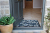 Atlantic Mats Iznik Tile Curious Collection Ocean Mat at an open front door entryway