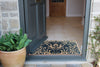 Atlantic Mats May Morris Tulip Blue Curious Collection doormat at an open front door entrance
