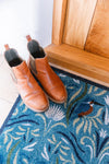 Brown leather Chelsea boots on a blue recycled Kingfisher doormat by Atlantic Mats