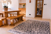 Atlantic Mats Antiqued Caption recycled rug in a rustic dining room with wooden furniture