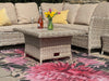 Atlantic Mats recycled rug with pink chrysanthemum design under a wicker patio set