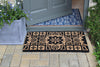 Atlantic Mats RHS Bloom Coir Doormat with Gertrude Jekyll Tile design on a paved porch