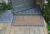 Atlantic Mats RHS Bloom Collection Coir Starburst Grey doormat at a grey front door