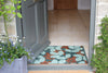 Atlantic Mats RHS Bloom Collection Ocean Mat with a layered leaf design at an open doorway