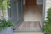 Atlantic Mats RHS Bloom Collection Ocean Mat with geometric pattern at a home entrance