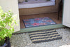 Atlantic Mats extra large rope doormat in grey and beige on a white gravel patio