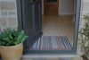 Atlantic Mats recycled natural and grey stripe doormat at a grey front door entrance
