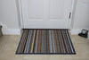 Atlantic Mats recycled doormat with natural and grey stripes in front of a white door