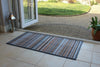 Atlantic Mats recycled natural and grey stripe runner on a tiled floor by an open door
