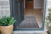 Atlantic Mats recycled plain grey runner doormat in a home entryway