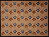 Zig-zag Paws Ocean Mat by Atlantic Mats with blue and brown paw prints on a tan background
